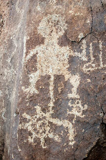 Indigenous Image and symbols on rock shutterstock_3206911