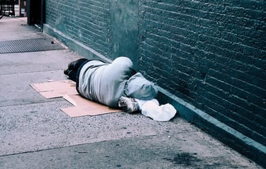 homeless man sleeping on the street