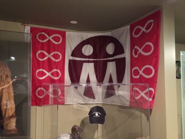 Metis_Flag_in_hanging_on_wall_of_Museum_of_History_2016.jpg