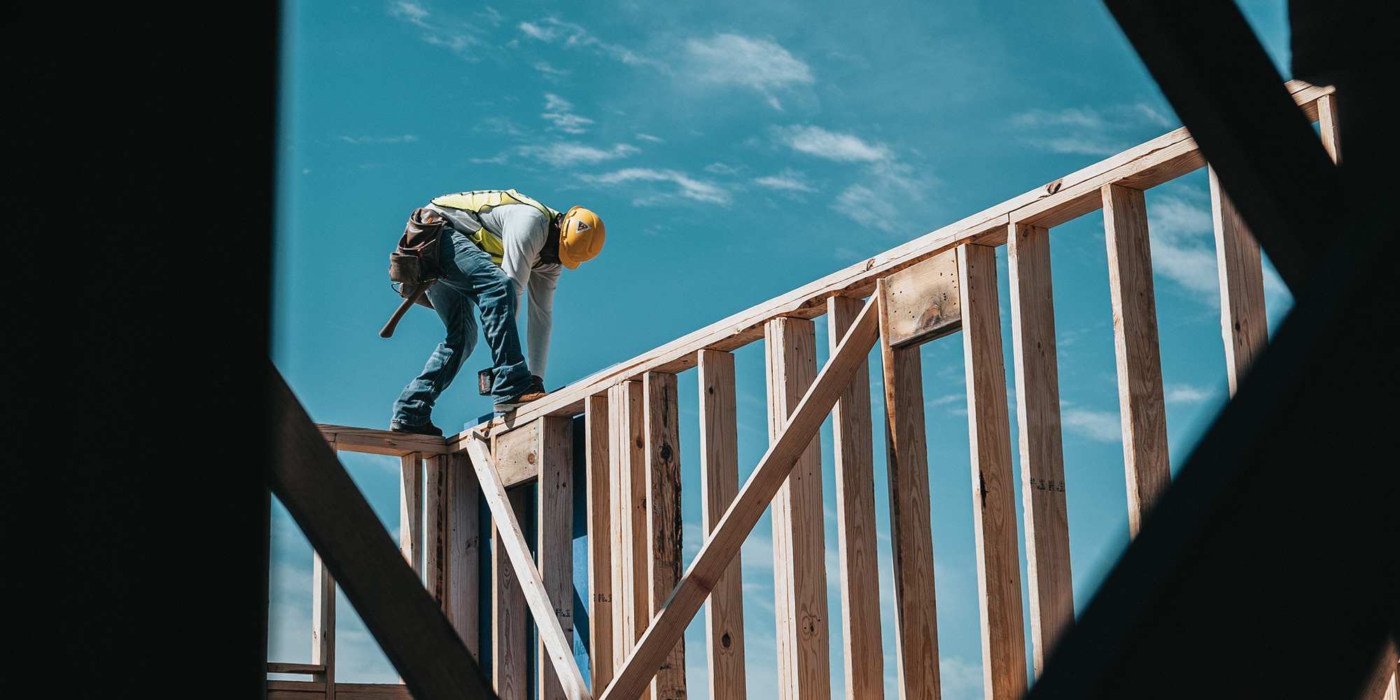 construction worker walking on frame