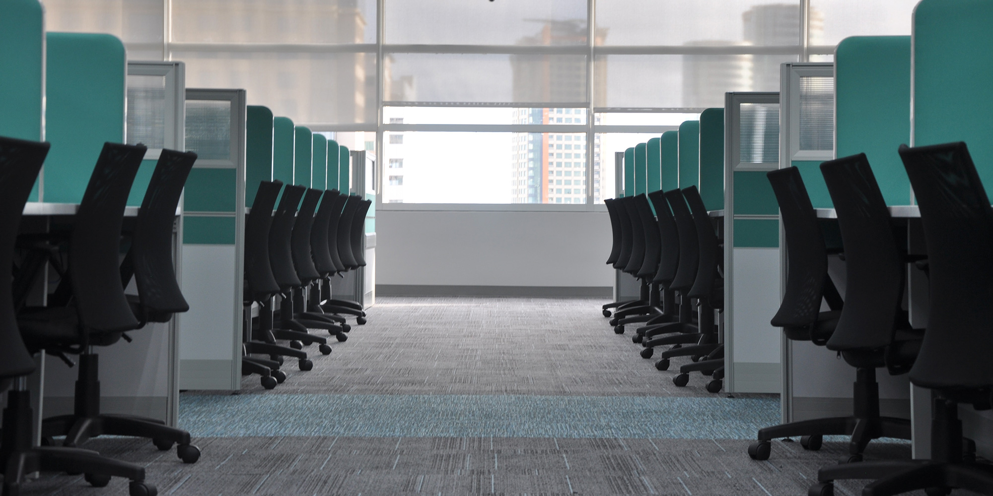 empty office cubicles and chairs