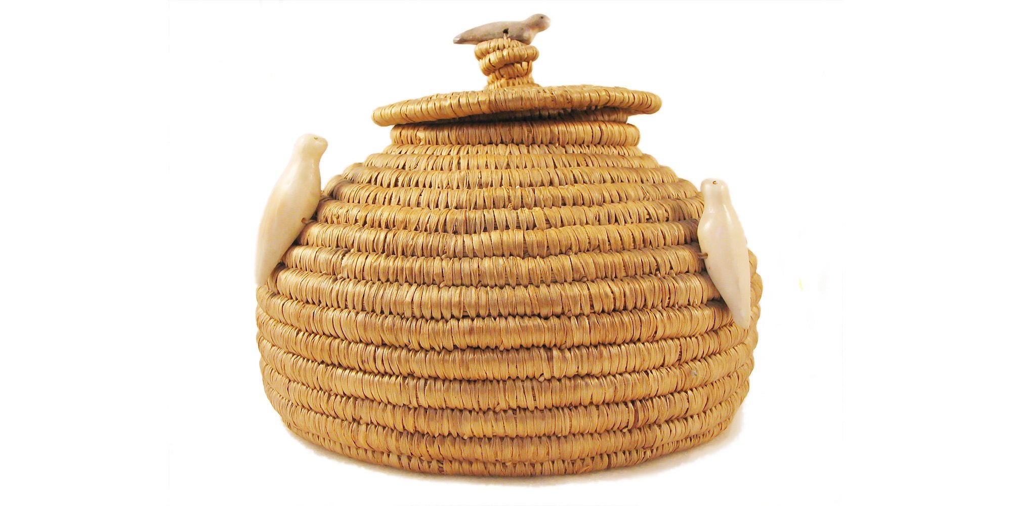 Lidded Eskimo basket with seal fetishes