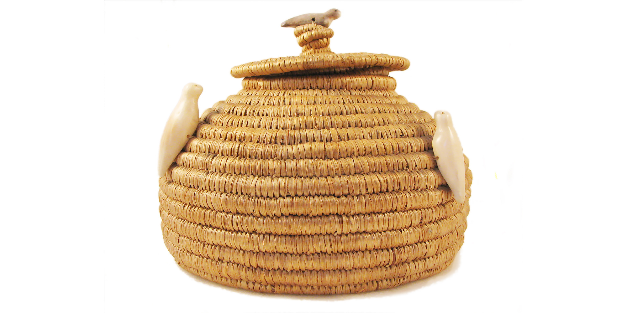 Lidded Eskimo basket with seal fetishes