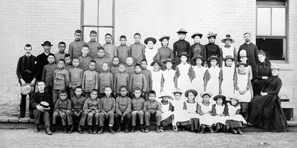 Students and staff at St. Paul's Indian Industrial School, Middlechurch, Manitoba, ca. 1901.