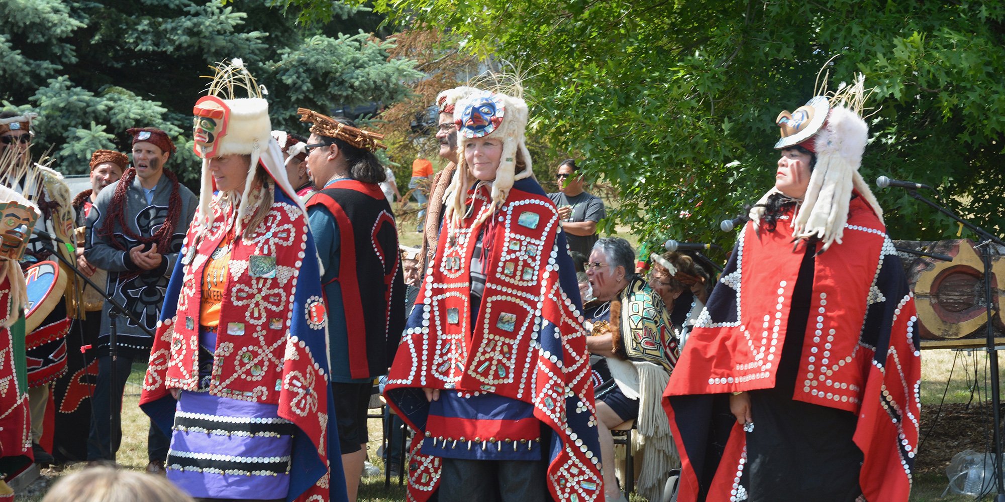 Women in regalia at a totem raising. National Indigenous Peoples' Day 2023. Photo: Doug Young