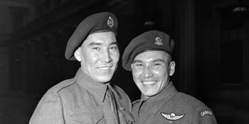 Sergeant Tommy Prince (right), 1st Canadian Parachute Battalion, with his brother, Private Morris Prince at an investiture at Buckingham Palace London, England, February 12, 1945